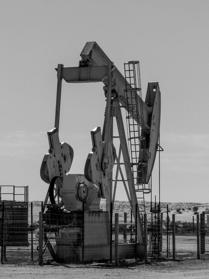 pexels-photo-16822262 Monochrome image of an oil pump in rural Arcachon, France, capturing industrial essence.